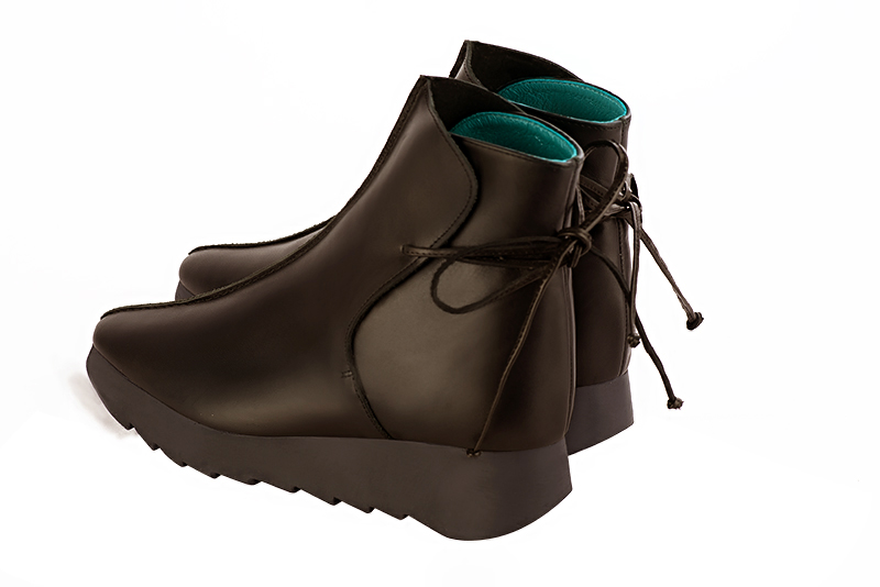 Dark brown women's ankle boots with laces at the back. Square toe. Low rubber soles. Rear view - Florence KOOIJMAN